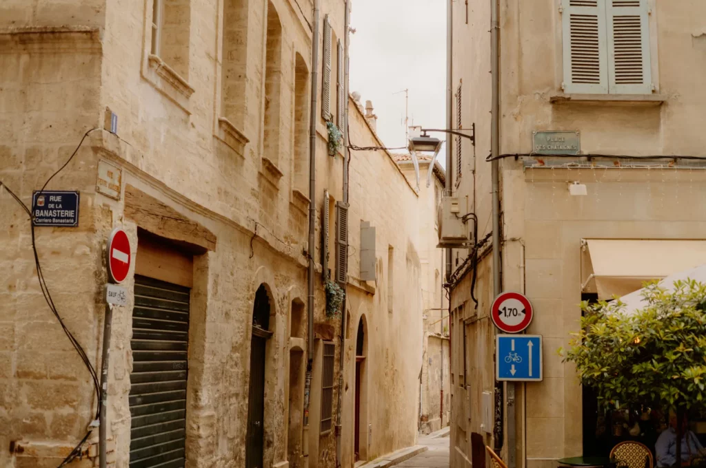 Street name signs in a narrow lane of old Avignon